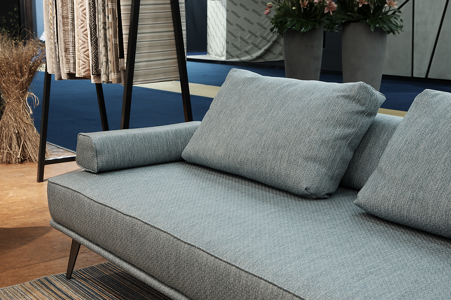 Gray couch with Vivalife fabric Kiwi at the Love Home Fabrics booth at Heimtextil 2020